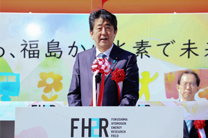 Photo of Prime Minister Abe at podium providing remarks