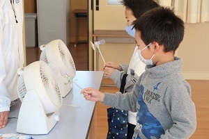 Photo of students learning about wind power generation