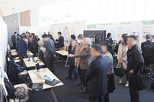 Photo of many visitors at panel display venue