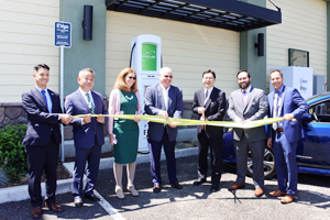 Photo of ribbon-cutting ceremony held in front of the high-power fast charger