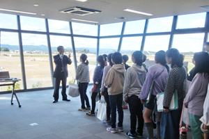 Photo of students observing drones from control room
