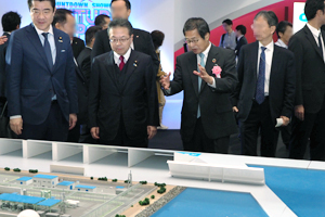 Mr. Hiroshige Seko, Member, House of Councillors, visiting exhibition area