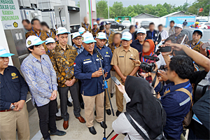 Photo of local media providing coverage of ceremony