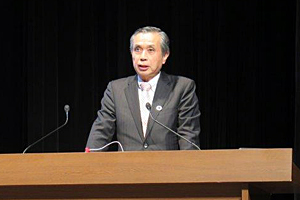 Photo of NITE President TATSUMI Takashi delivering opening remarks