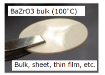 BaZrO3 bulk (100℃), sheet, thin film, etc. This figure shows a ceramic sheet composed of barium zirconate sintered at 100℃. Sintering at lower temperatures than conventional method  leads to a reduction of CO2 emissions.
