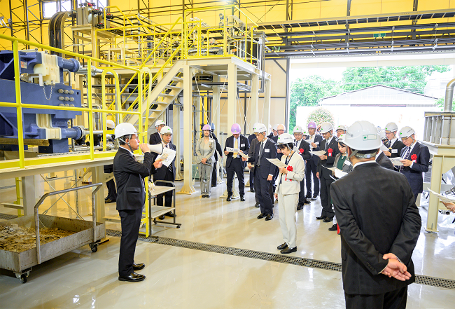 Photo of a tour of the pilot-scale facility for artificial limestone production using recycled CO2 and waste materials